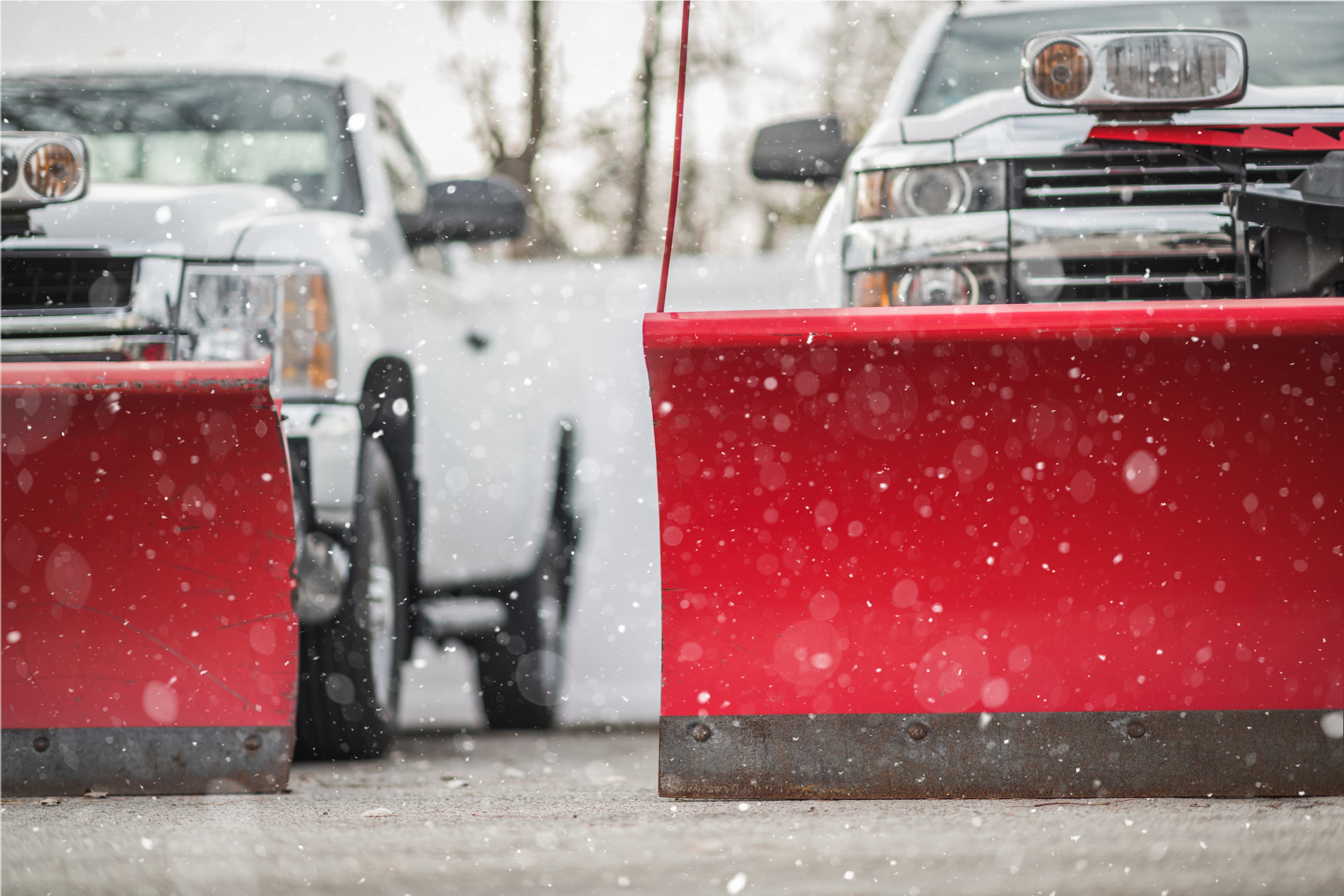 BAM Lawns snow removal truck clearing a residential driveway in Bellevue, NE